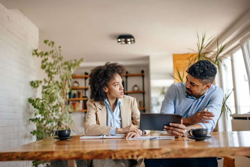 Adult black woman, being mentored by her senior.