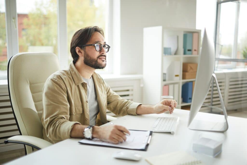 Software engineer analyzing computer error